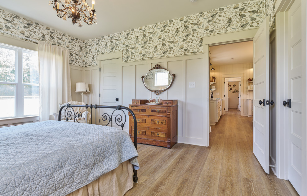 Inspiration for a medium sized shabby-chic style master bedroom in Charlotte with white walls, vinyl flooring, no fireplace, beige floors, a vaulted ceiling and wallpapered walls.