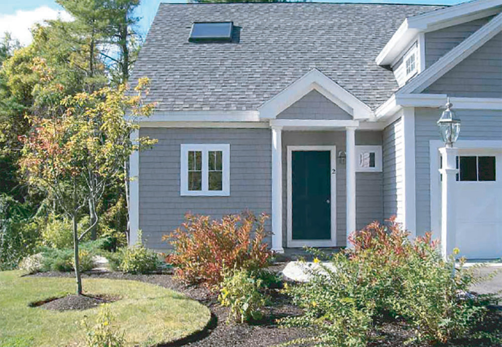 Photo of a mid-sized transitional full sun and drought-tolerant front yard stone garden path in Boston for summer.