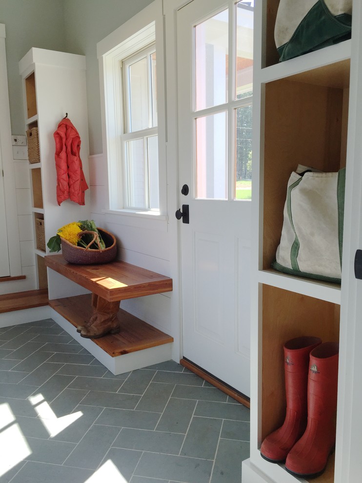 Photo of a mid-sized country mudroom in Burlington with grey walls, slate floors, a single front door and a white front door.