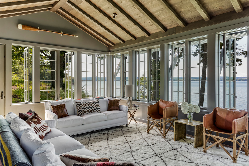 Design ideas for a mid-sized country sunroom in New York with medium hardwood floors, brown floor and a standard ceiling.