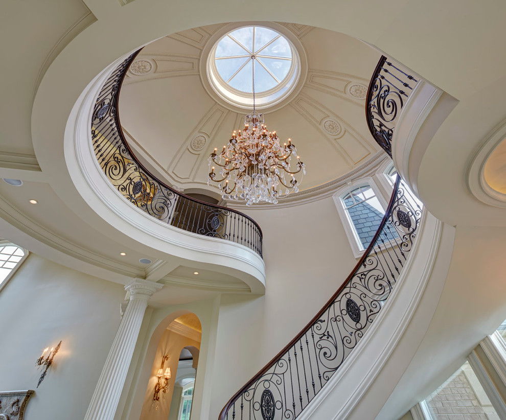 This is an example of a traditional curved staircase in Detroit.