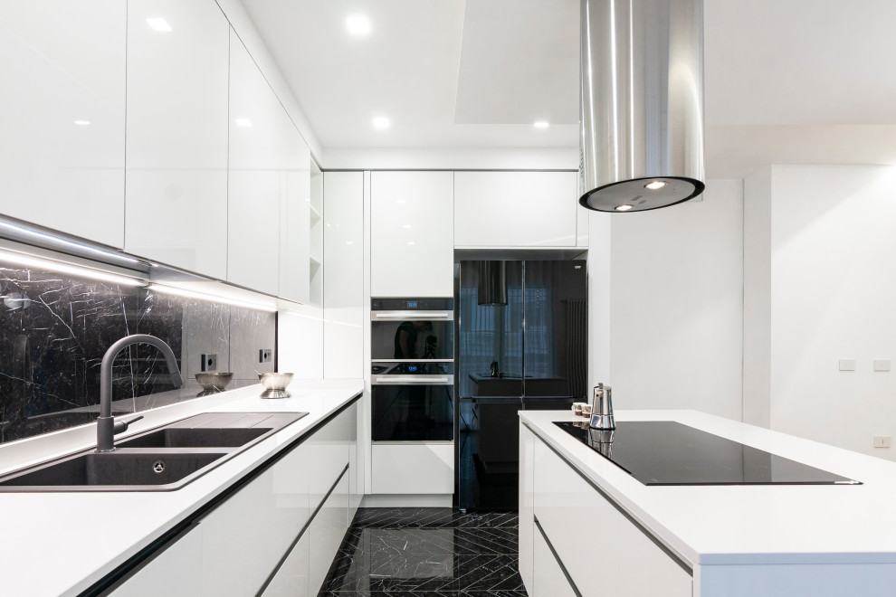 Inspiration for a large modern galley eat-in kitchen in Naples with a double-bowl sink, beaded inset cabinets, white cabinets, quartzite benchtops, black splashback, marble splashback, black appliances, marble floors, with island, black floor, white benchtop and recessed.