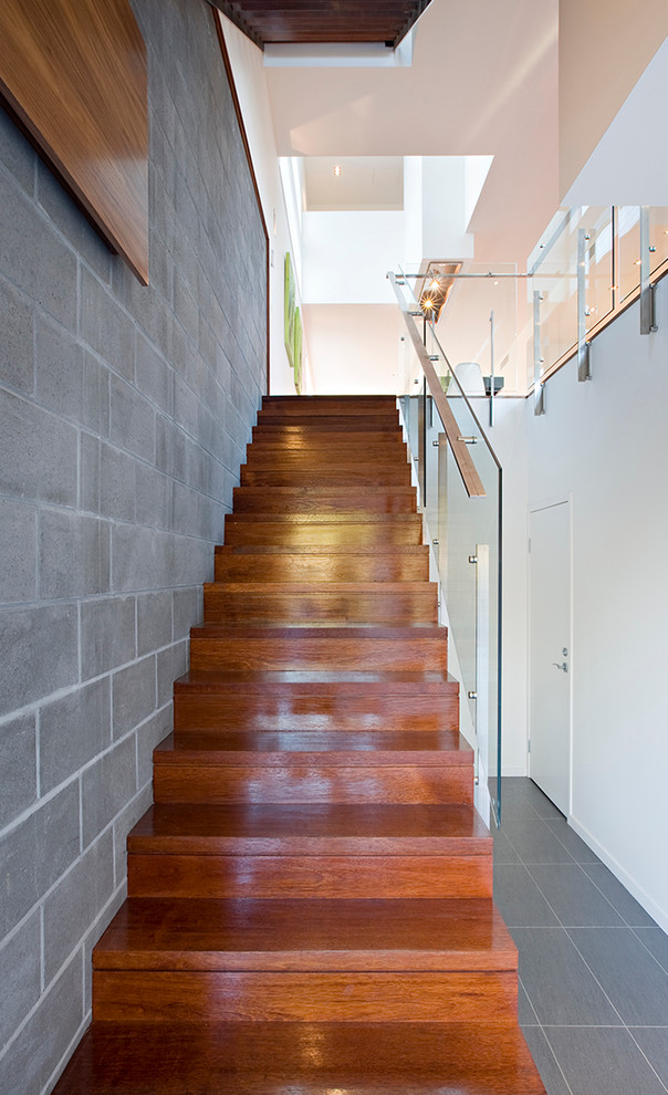 Contemporary wood straight staircase in Brisbane with wood risers.