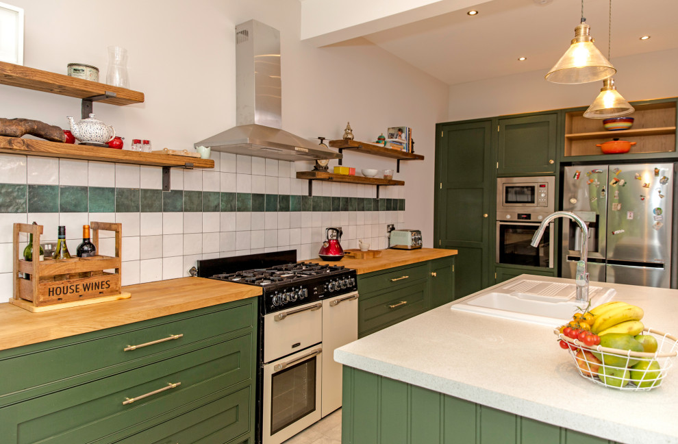 Inspiration for a large classic kitchen/diner in Dorset with shaker cabinets, green cabinets, wood worktops, an island and brown worktops.