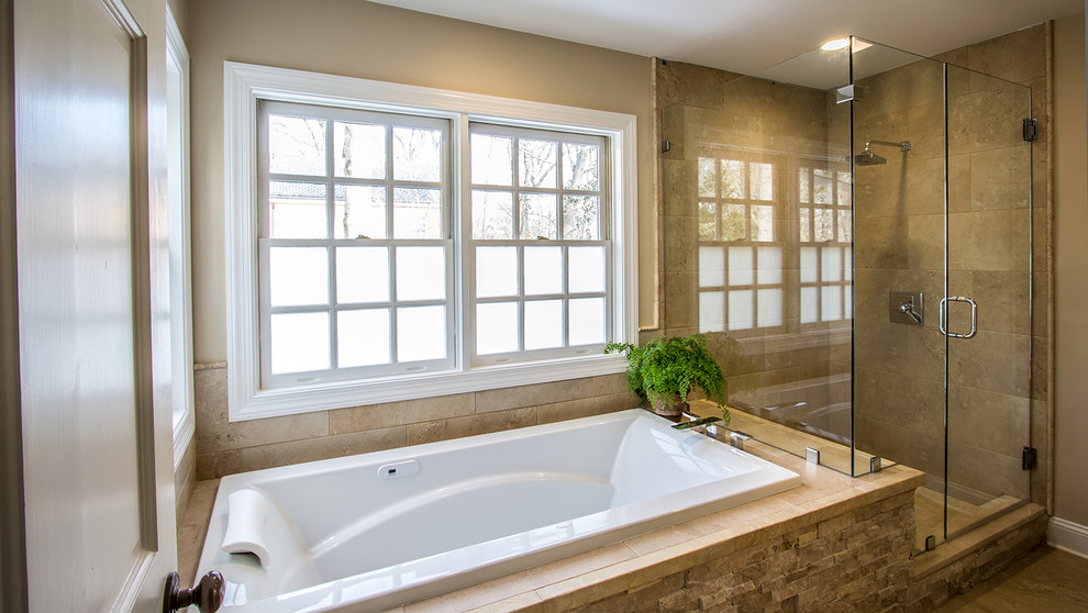This is an example of a mid-sized modern master bathroom in Richmond with an undermount sink, flat-panel cabinets, medium wood cabinets, engineered quartz benchtops, a drop-in tub, a corner shower, a wall-mount toilet, brown tile, porcelain tile, brown walls and porcelain floors.