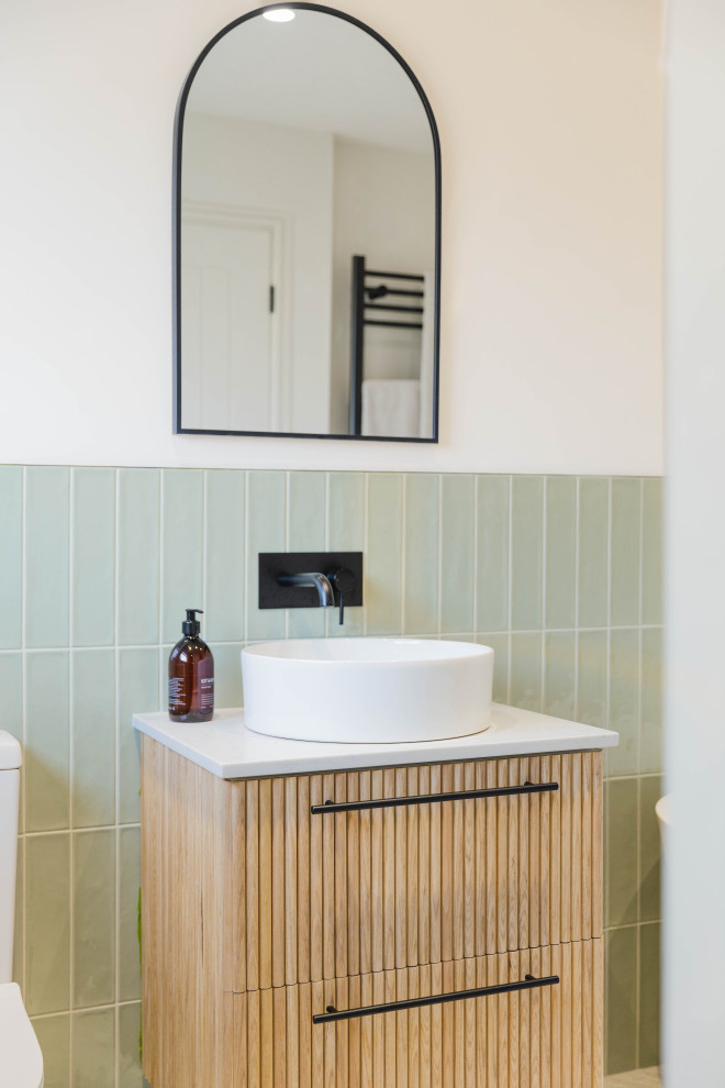 Design ideas for a mid-sized scandinavian master bathroom in Sussex with light wood cabinets, a freestanding tub, green tile, ceramic tile, beige walls, a console sink, quartzite benchtops, white benchtops, a single vanity and a floating vanity.