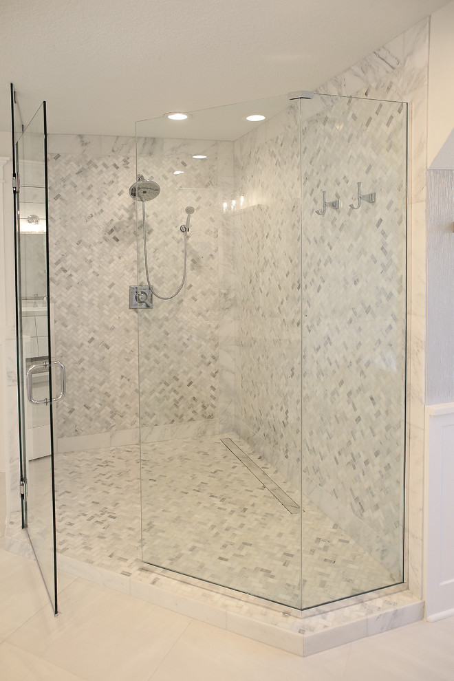 Example of a mid-sized transitional master porcelain tile and white floor freestanding bathtub design with an undermount sink and a hinged shower door
