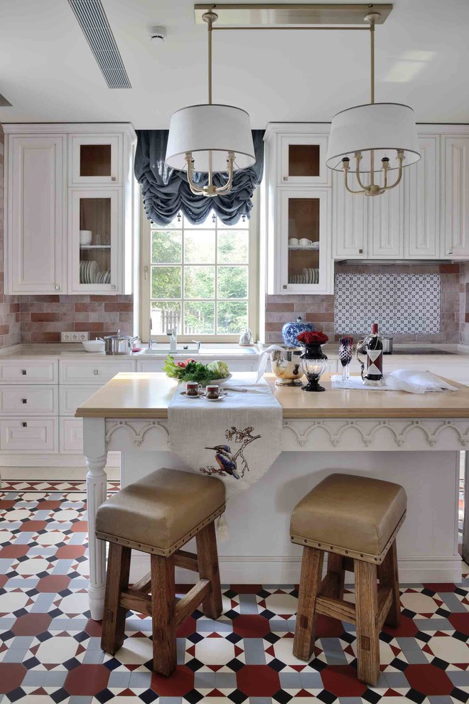 Inspiration for a large traditional u-shaped separate kitchen in Moscow with white cabinets, multi-coloured splashback, with island, an undermount sink, raised-panel cabinets, marble benchtops, terra-cotta splashback, stainless steel appliances, terra-cotta floors, multi-coloured floor and beige benchtop.