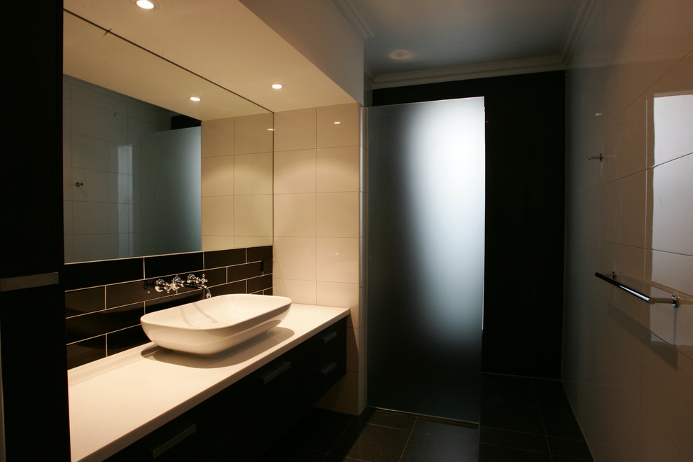 Traditional kids bathroom in Brisbane with open cabinets, dark wood cabinets, an open shower, a one-piece toilet, white tile, ceramic tile, white walls, porcelain floors, a vessel sink, engineered quartz benchtops, grey floor, an open shower and white benchtops.
