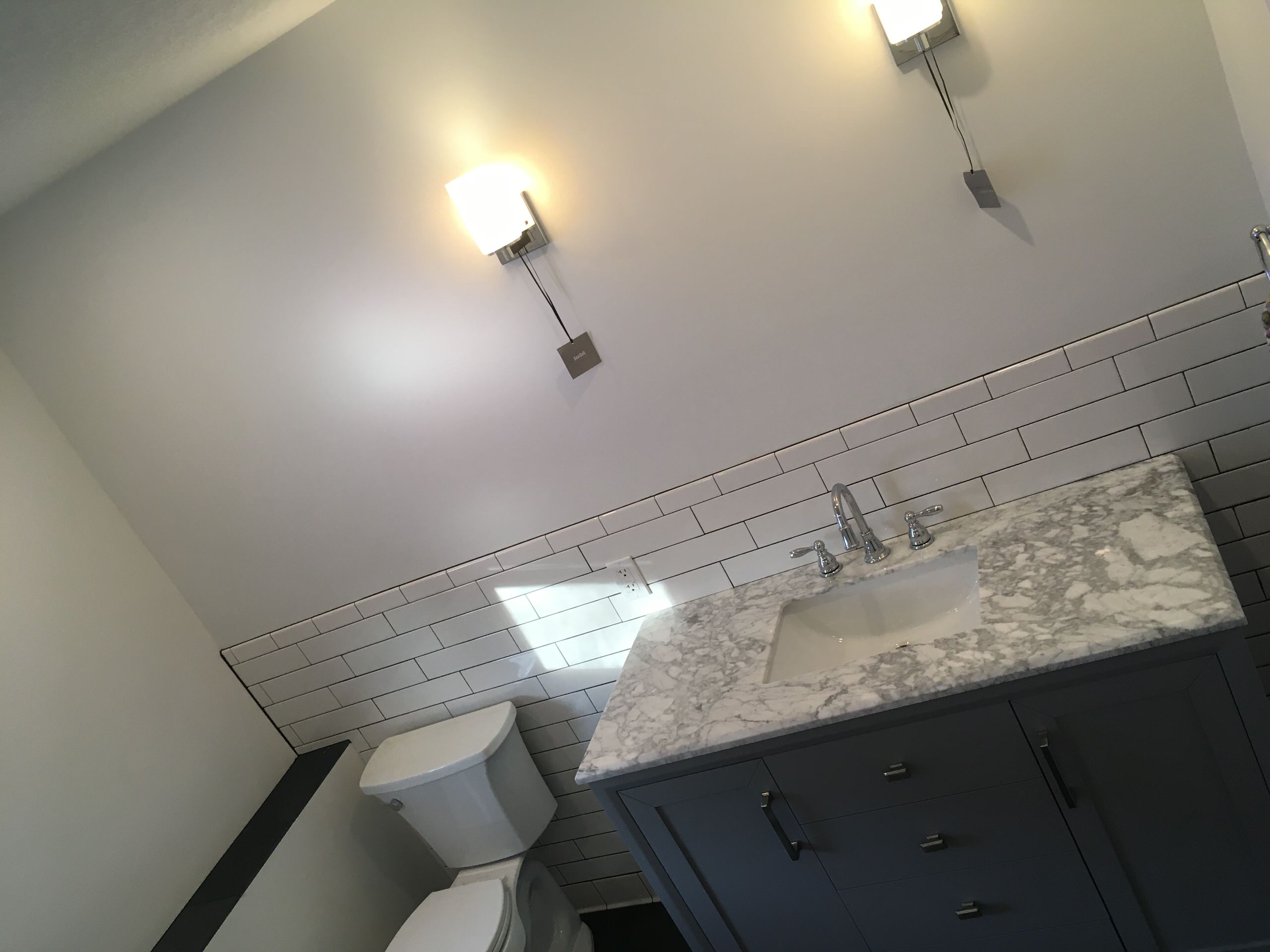 Subway tile shower and Stone floor