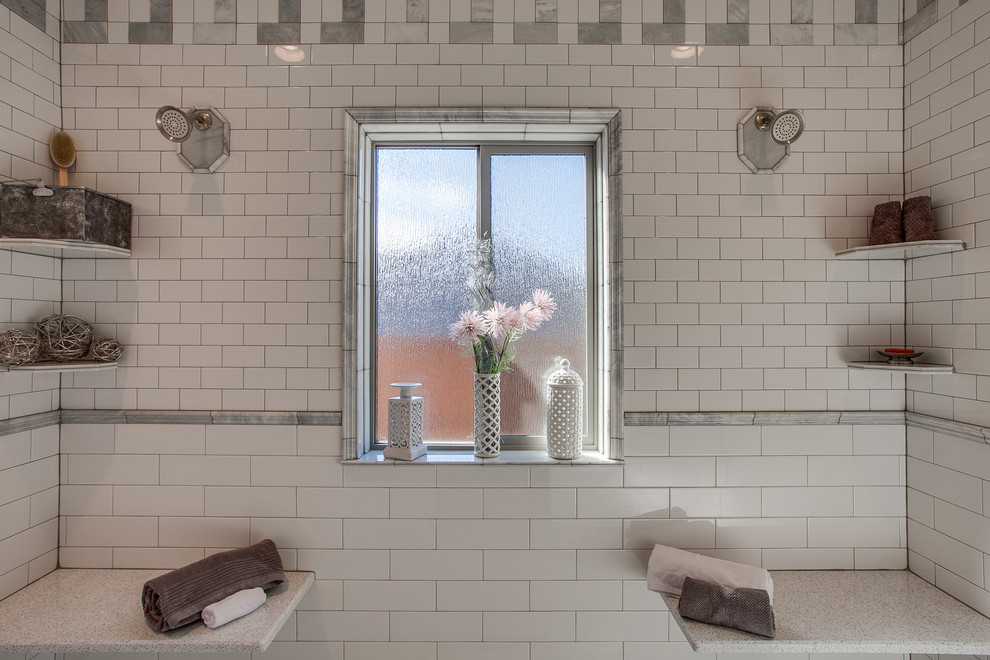 Transitional master bathroom in Seattle with a double shower, subway tile and white walls.