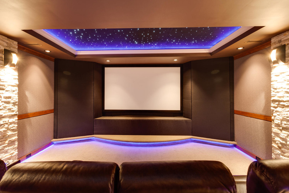 Photo of a modern home theatre in DC Metro with carpet and a projector screen.