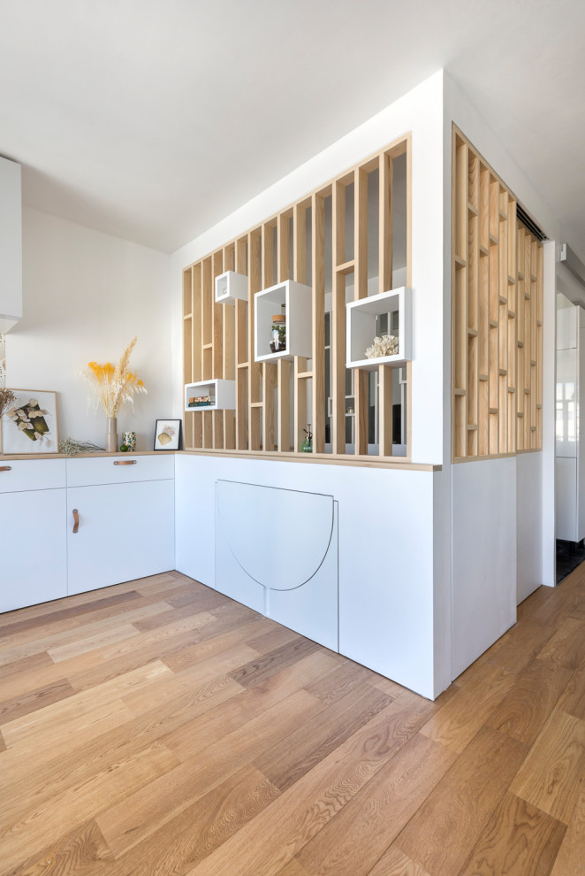 Design ideas for a contemporary open plan dining in Paris with plywood floors.