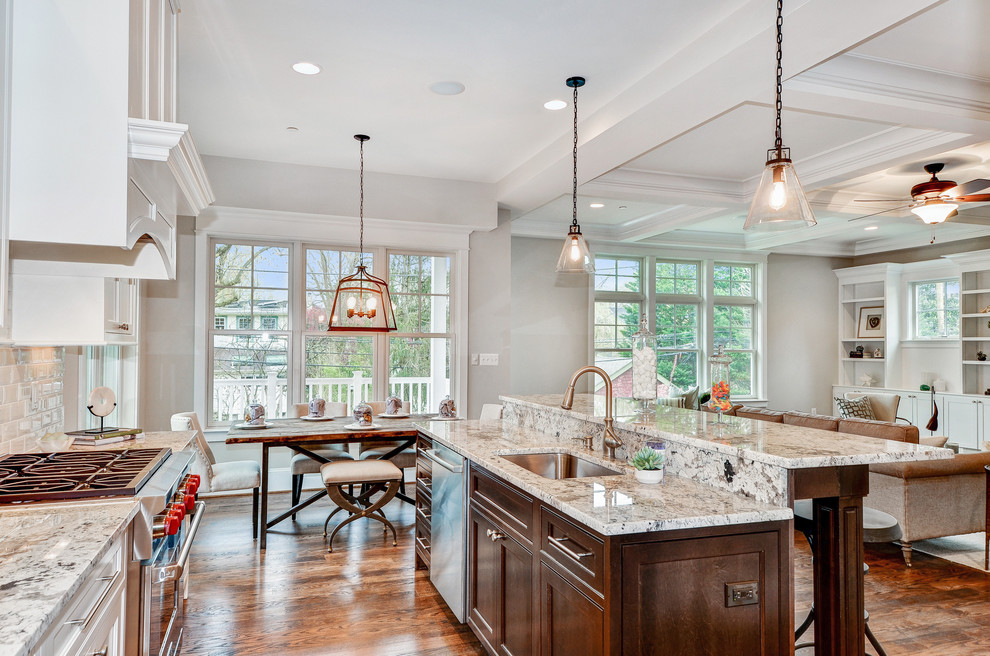 Open concept kitchen - mid-sized transitional l-shaped medium tone wood floor and brown floor open concept kitchen idea in DC Metro with an undermount sink, white cabinets, granite countertops, white backsplash, stainless steel appliances, no island, recessed-panel cabinets and subway tile backsplash