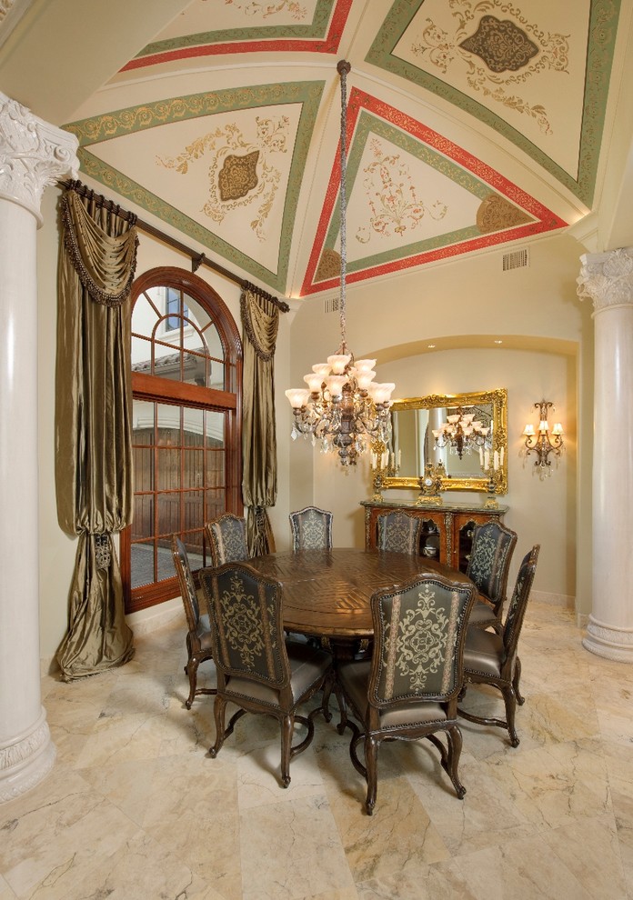 This is an example of a mediterranean dining room in Houston with beige walls.