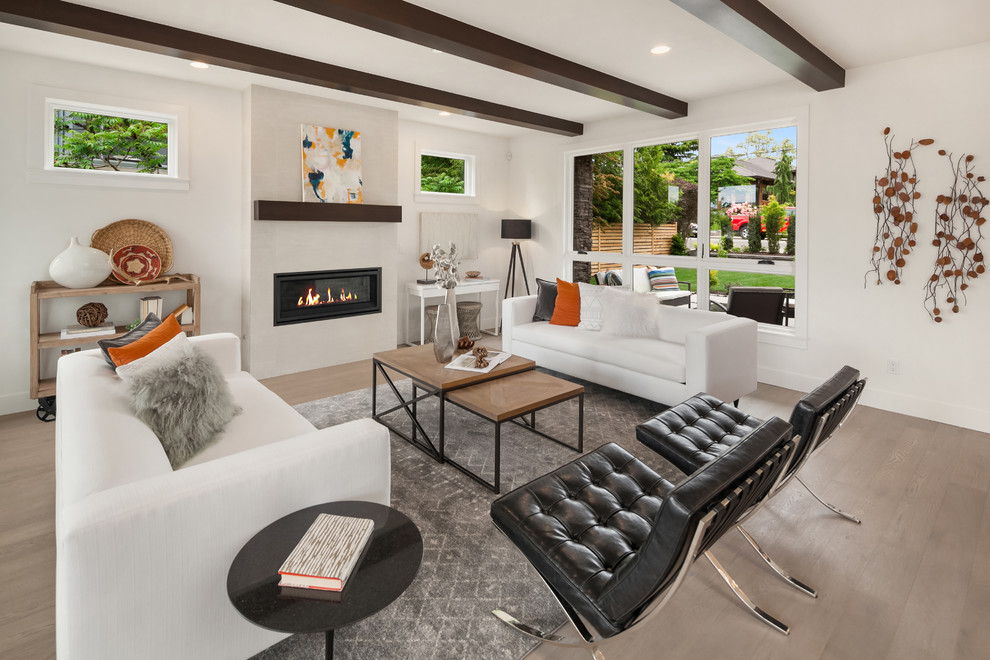 Design ideas for a midcentury formal open concept living room in Seattle with white walls, light hardwood floors, a ribbon fireplace and no tv.