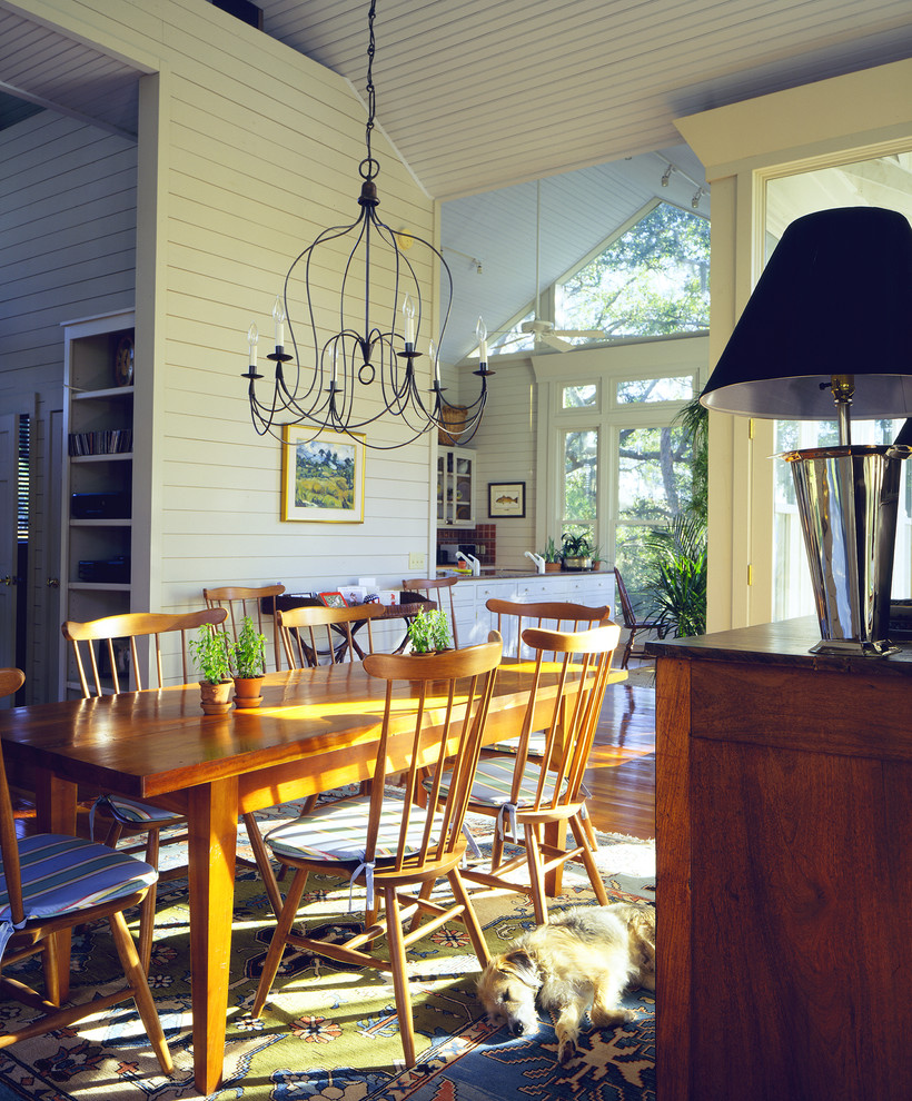 Inspiration for a beach style dining room in Atlanta with white walls and dark hardwood floors.