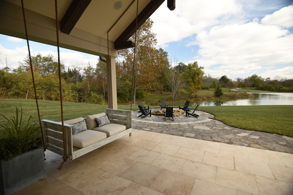 Photo of a large country courtyard patio in Cincinnati with a fire feature and a gazebo/cabana.