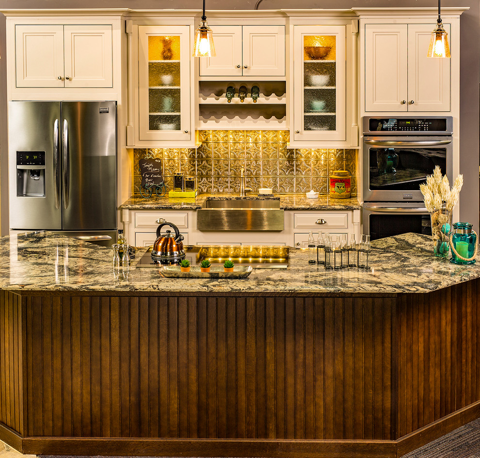 Inspiration for a mid-sized timeless kitchen remodel with a farmhouse sink, shaker cabinets, white cabinets, granite countertops, metallic backsplash, metal backsplash, stainless steel appliances and an island