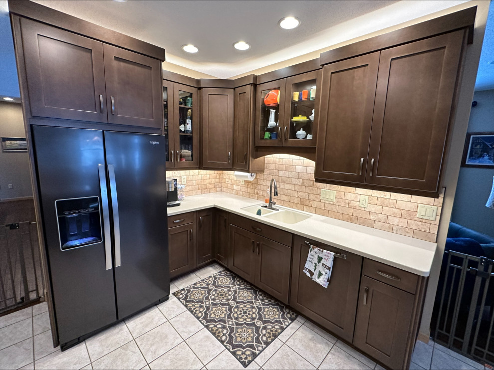 Design ideas for a mid-sized traditional kitchen pantry in Other with shaker cabinets, medium wood cabinets and travertine splashback.
