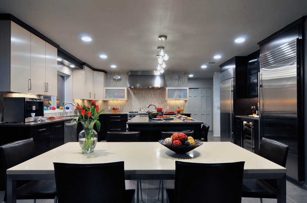 Photo of a large contemporary l-shaped eat-in kitchen in New York with stainless steel appliances, an undermount sink, black cabinets, multi-coloured splashback, ceramic floors and with island.