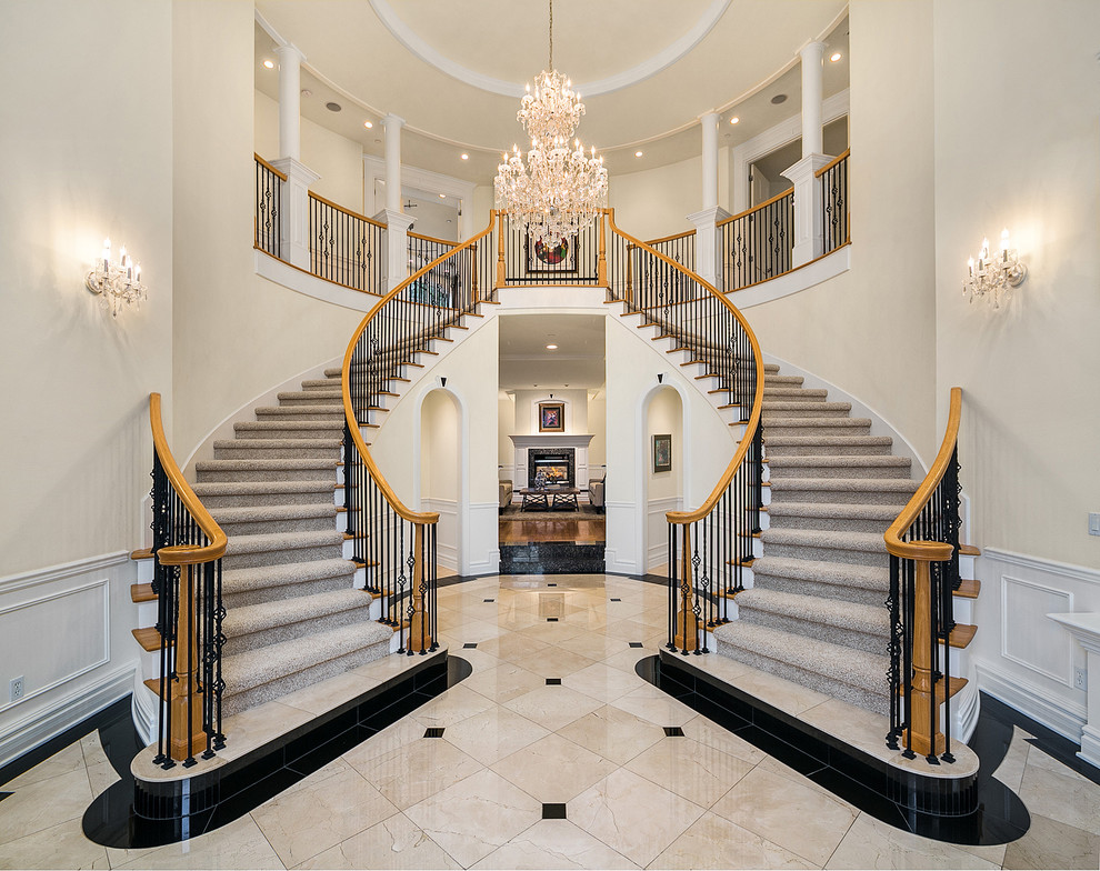 Inspiration for a traditional foyer in Seattle with beige walls and beige floor.