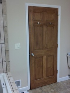 keep wood door with white trim or stain everything