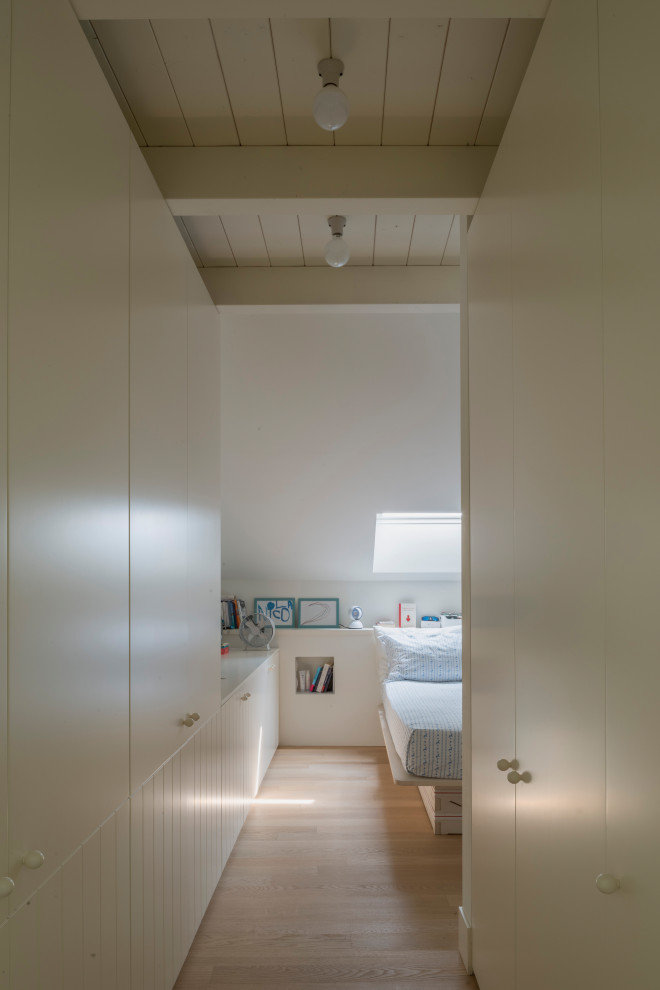 This is an example of a beach style bedroom in Milan.