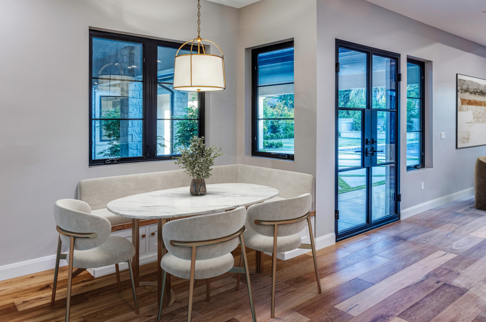 Pendant Lit Breakfast Nook & Black Framed Glass Doors | French Country Transitio