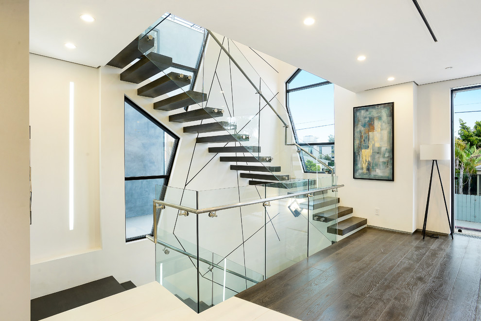 Contemporary wood floating staircase in Los Angeles with open risers.