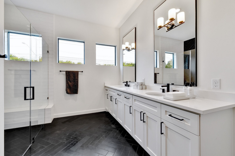 Inspiration for a large transitional bathroom in Austin with shaker cabinets, white cabinets, an alcove shower, white tile, subway tile, white walls, an undermount sink, black floor, a hinged shower door and white benchtops.