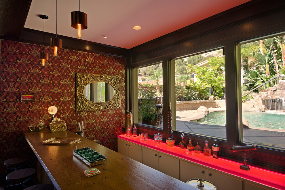This is an example of a mid-sized midcentury home bar in Orange County.