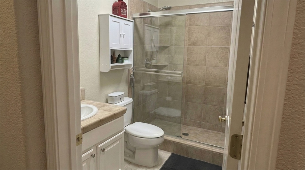 BEFORE: ORIGINAL BATHROOM WITH WALK-IN SHOWER