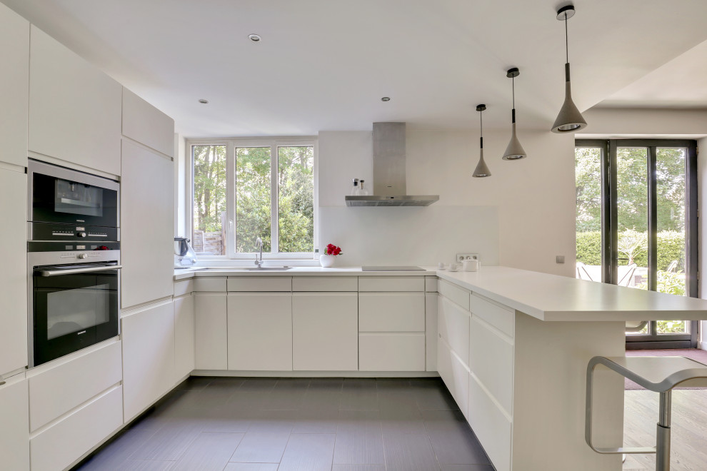 Photo of a large contemporary kitchen in Other with beaded inset cabinets, white cabinets, ceramic floors and black floor.