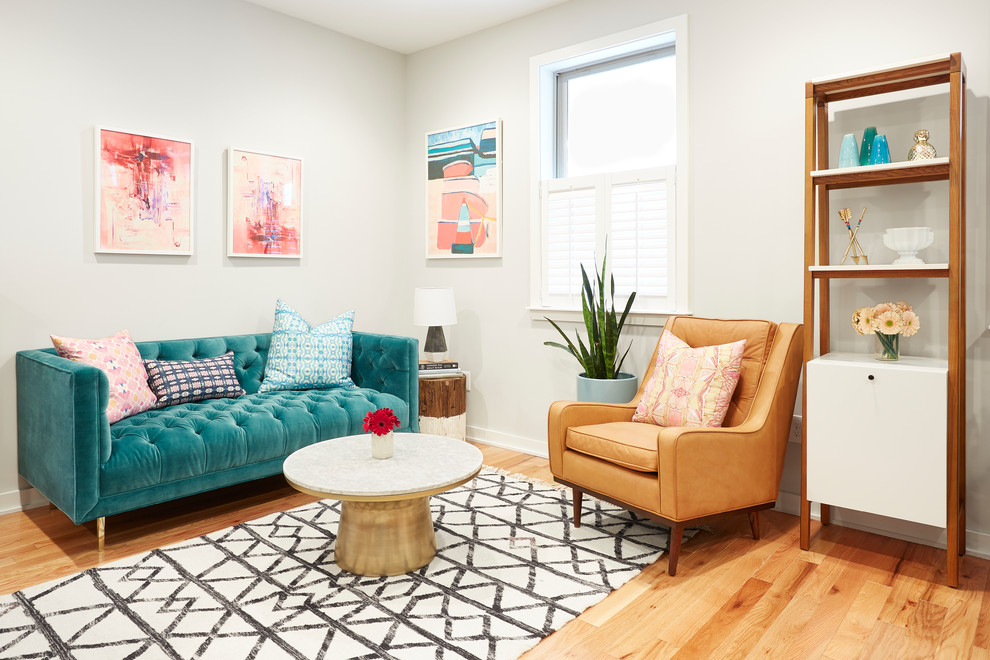 Mid-sized eclectic open concept living room in Philadelphia with grey walls, no fireplace, no tv, light hardwood floors and beige floor.
