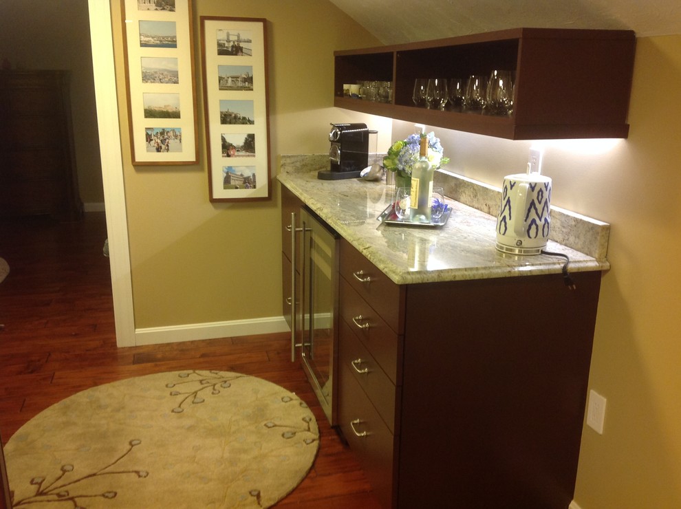Large transitional single-wall medium tone wood floor home design photo in Boston with no sink, dark wood cabinets and granite countertops