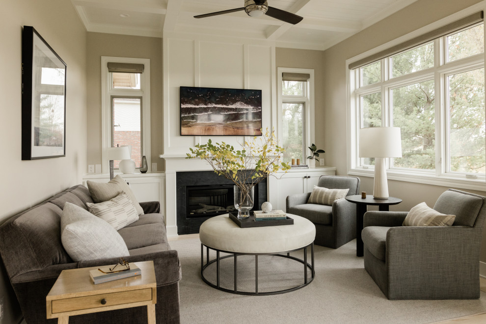 Design ideas for a small transitional enclosed family room in Other with grey walls, light hardwood floors, a standard fireplace, a stone fireplace surround, a wall-mounted tv and coffered.