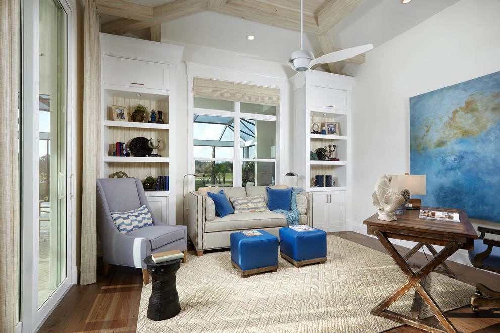 Beach style study room in Tampa with white walls, medium hardwood floors, no fireplace and a freestanding desk.