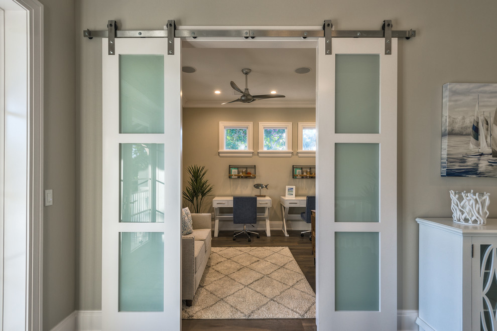 Example of a transitional home design design in Miami