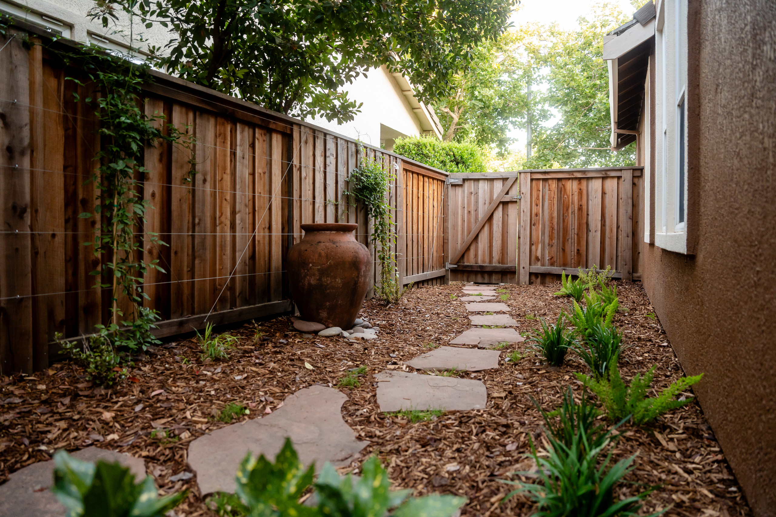 Side Garden with Custom Trellis and Framing Greenery