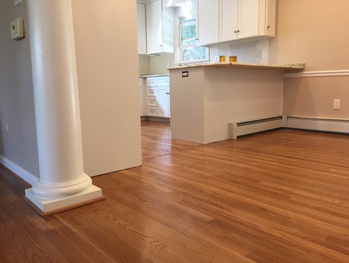 Kitchen remodel: shoe molding to match cherry floor or white cabinets?