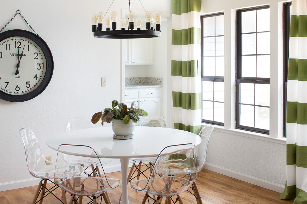 Inspiration for a small transitional dining room in Sacramento with white walls and medium hardwood floors.