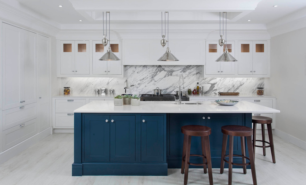 Inspiration for a mid-sized transitional l-shaped kitchen in Other with an undermount sink, shaker cabinets, quartzite benchtops, grey splashback, marble splashback, stainless steel appliances, light hardwood floors, with island, white floor and blue cabinets.