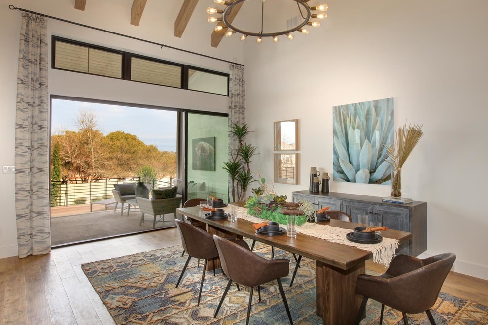 Large transitional medium tone wood floor and brown floor dining room photo in Austin with white walls and no fireplace