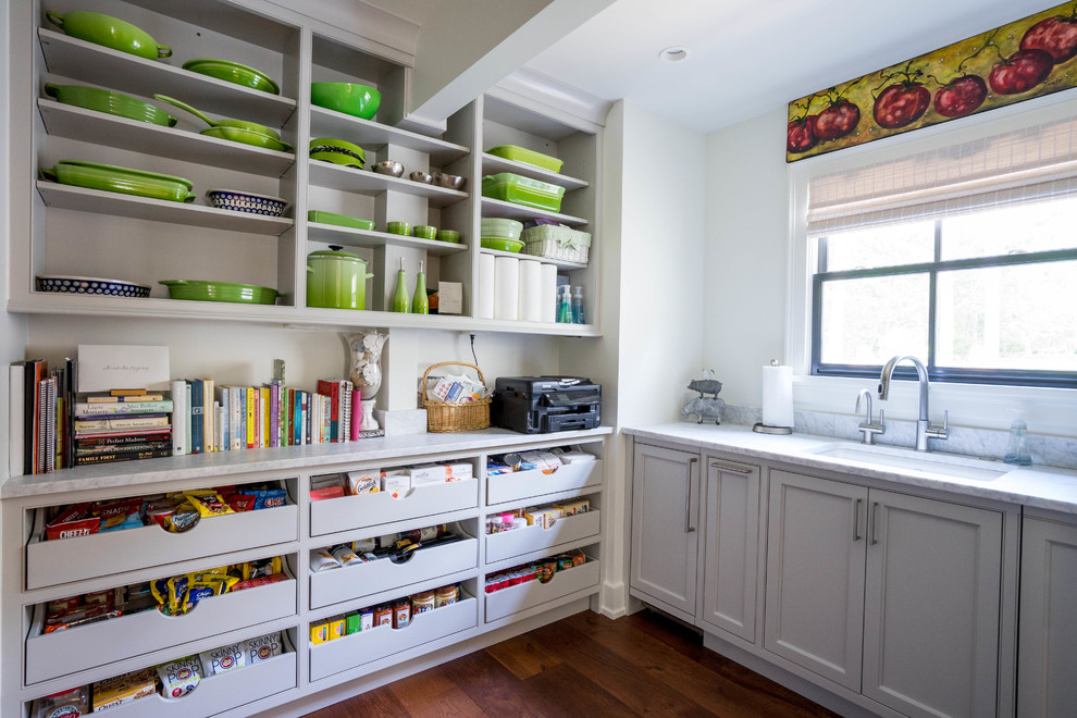 Design ideas for a mid-sized transitional kitchen pantry in Other with an undermount sink, beaded inset cabinets, grey cabinets, marble benchtops, white splashback, dark hardwood floors, brown floor, grey benchtop and no island.