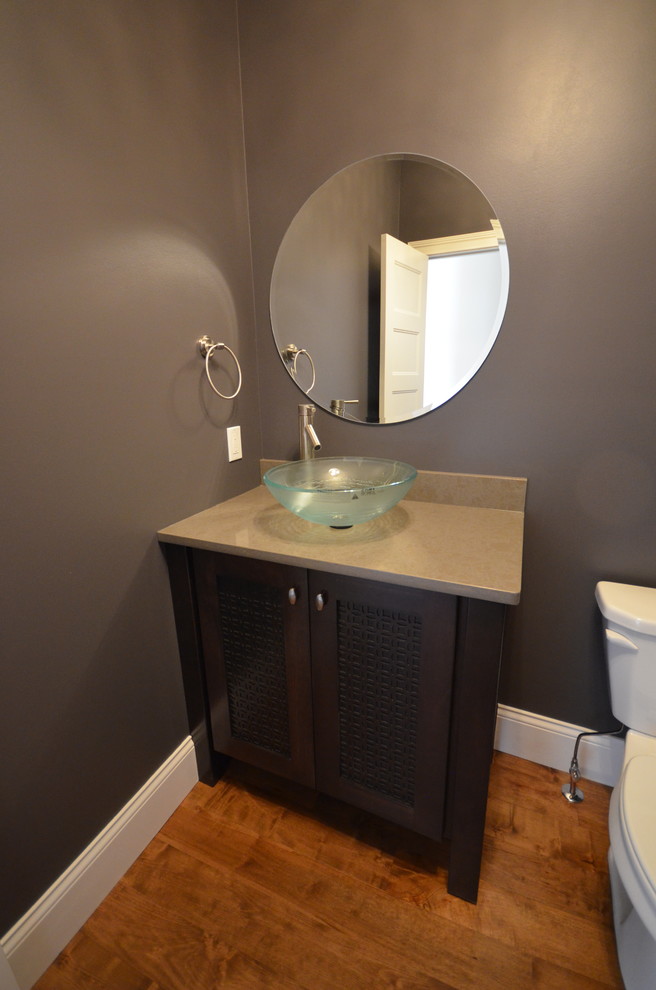 Photo of a modern powder room in Richmond with dark wood cabinets.