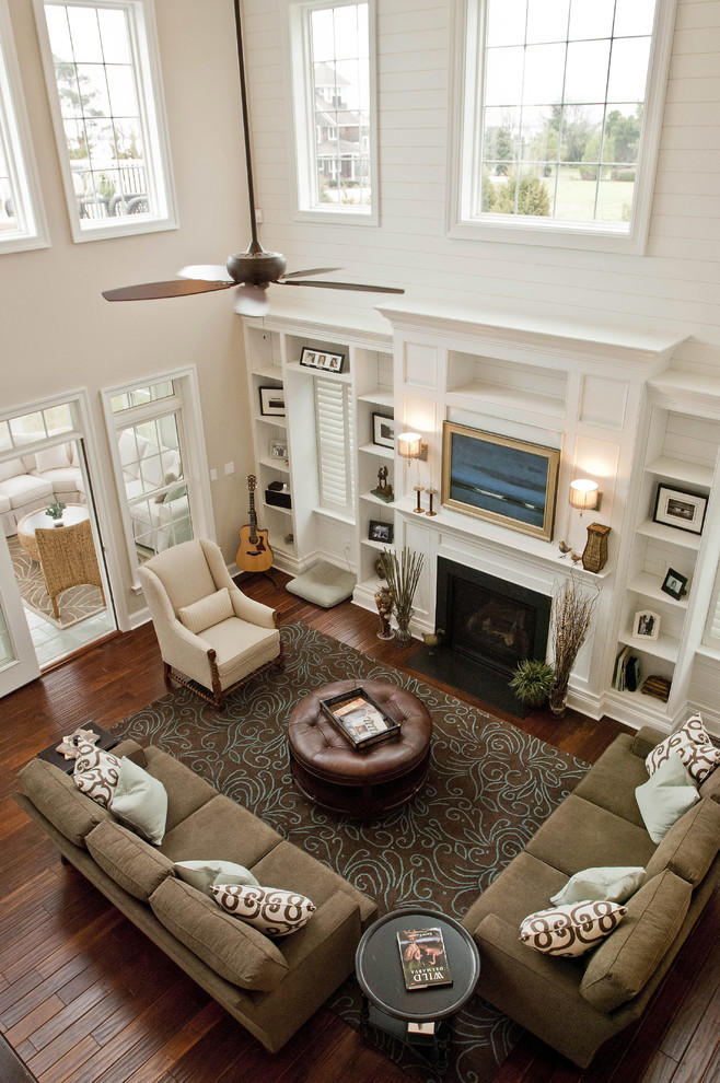Inspiration for a large traditional formal open concept living room in Other with white walls, dark hardwood floors, a standard fireplace and no tv.