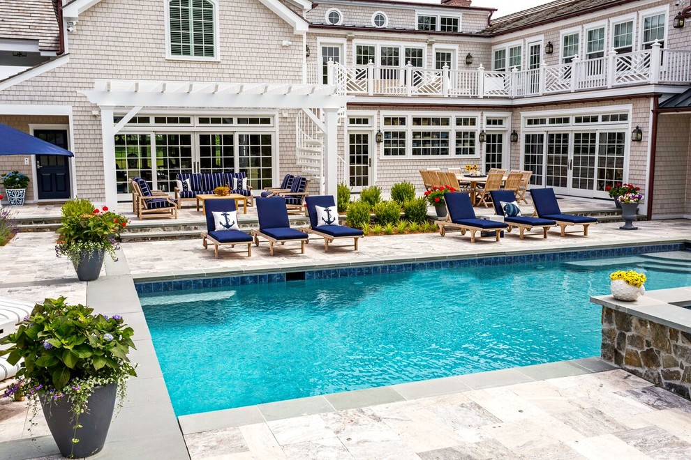 Example of a large transitional backyard stone and rectangular lap hot tub design