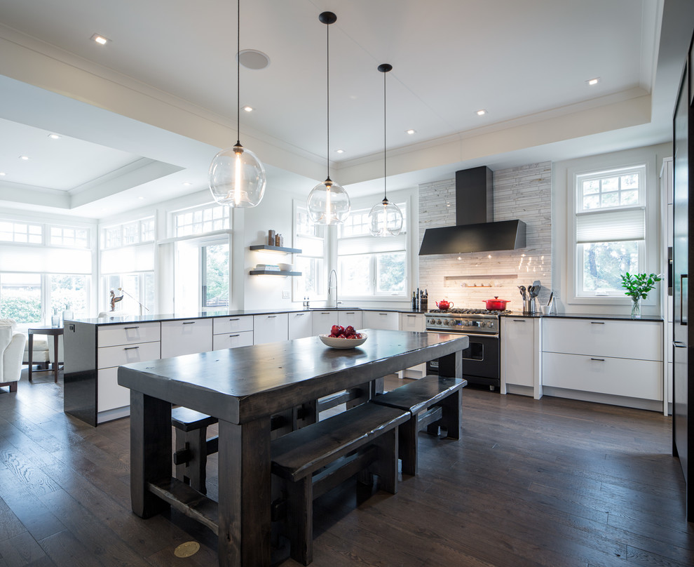 Design ideas for an expansive transitional u-shaped open plan kitchen in Ottawa with a double-bowl sink, flat-panel cabinets, white cabinets, marble benchtops, beige splashback, porcelain splashback, panelled appliances, dark hardwood floors and a peninsula.