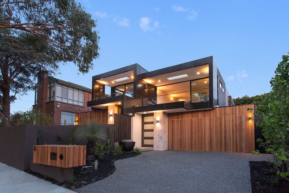 Design ideas for a midcentury two-storey exterior in Melbourne.